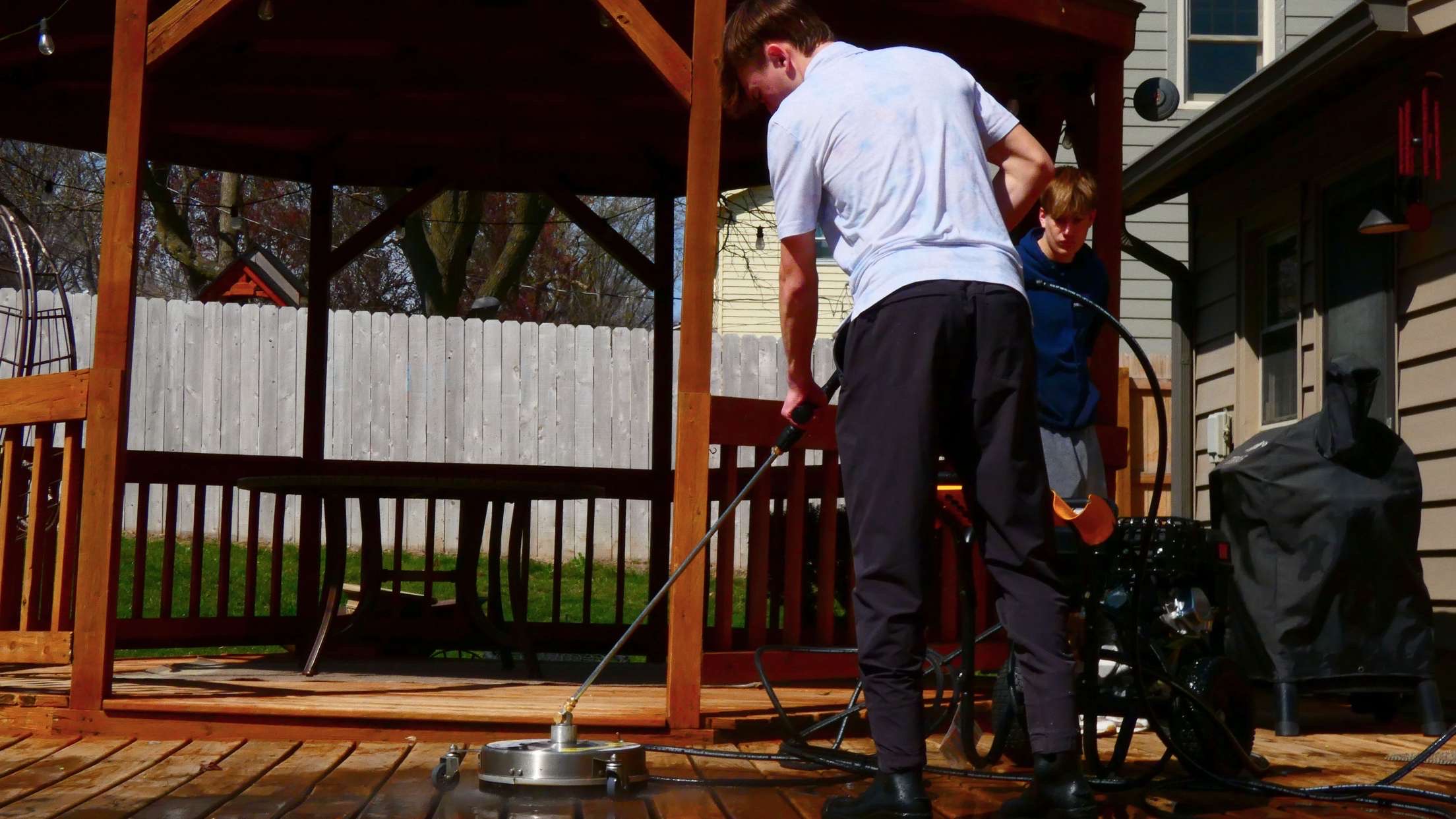 Pressure washing a wooden deck